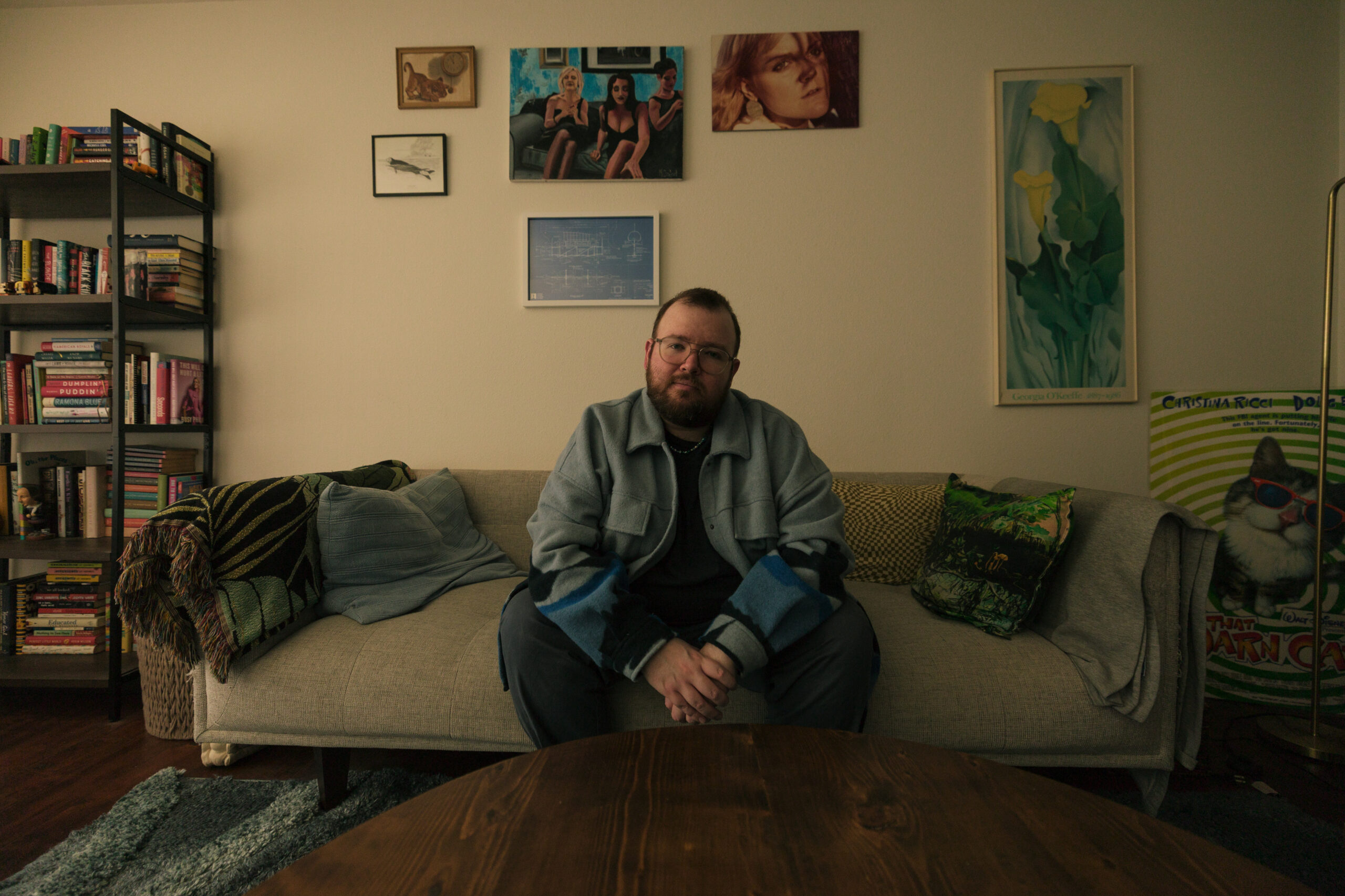 Bryce sitting on couch looking at camera