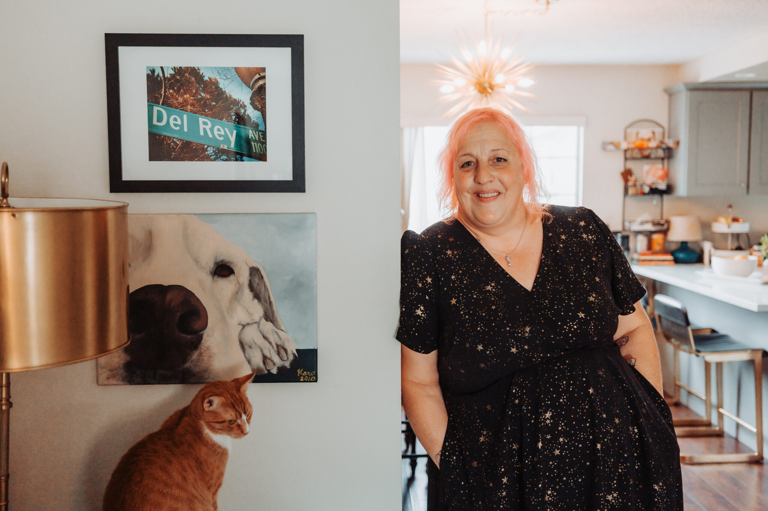 Amanda and her cat in the living room at home