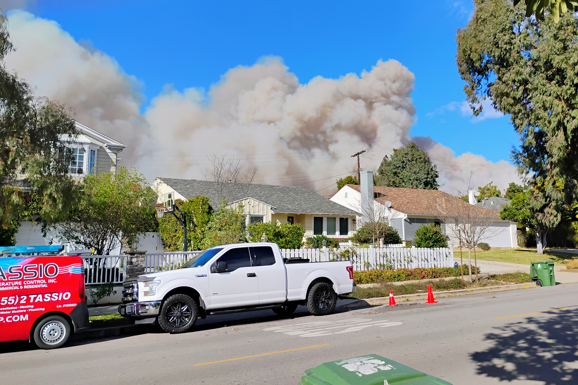 Large cloud of smoke in residential neighborhood