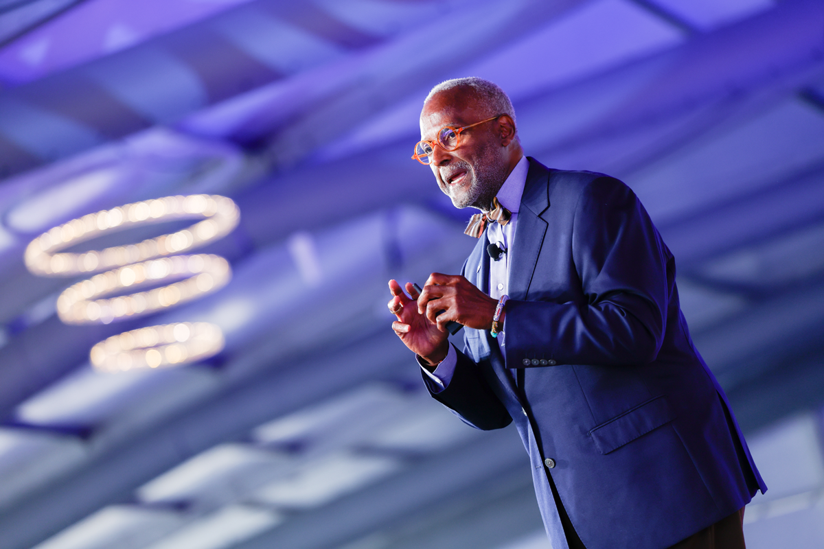 Raymond Jetson speaking on stage at EMERGE Financial Health 2025