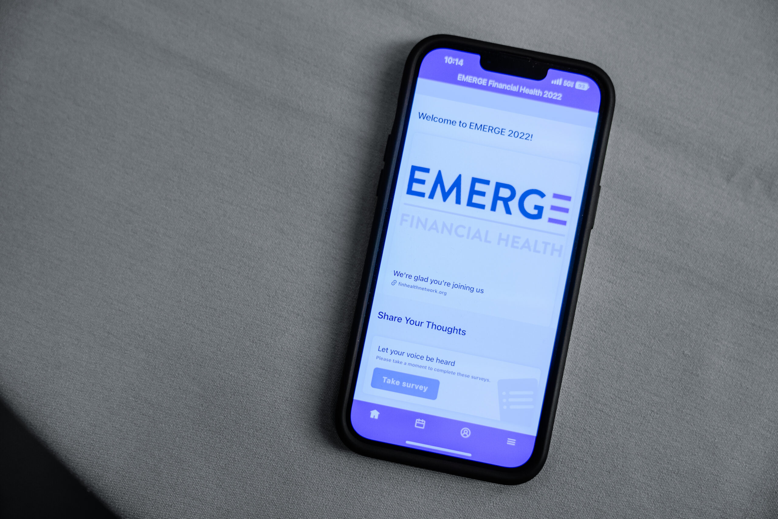 smartphone opened to the EMERGE conference app