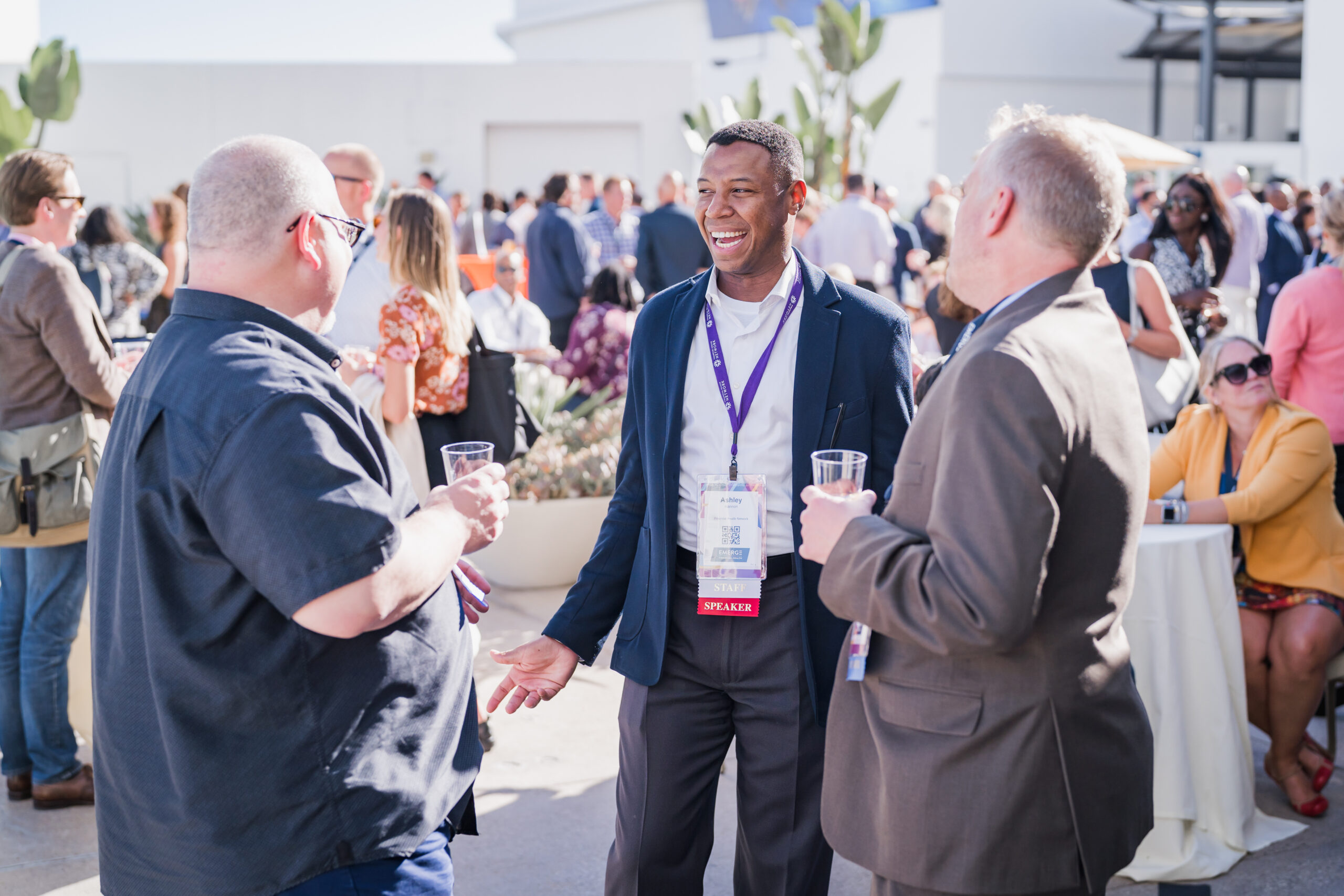 attendees at a poolside EMERGE reception