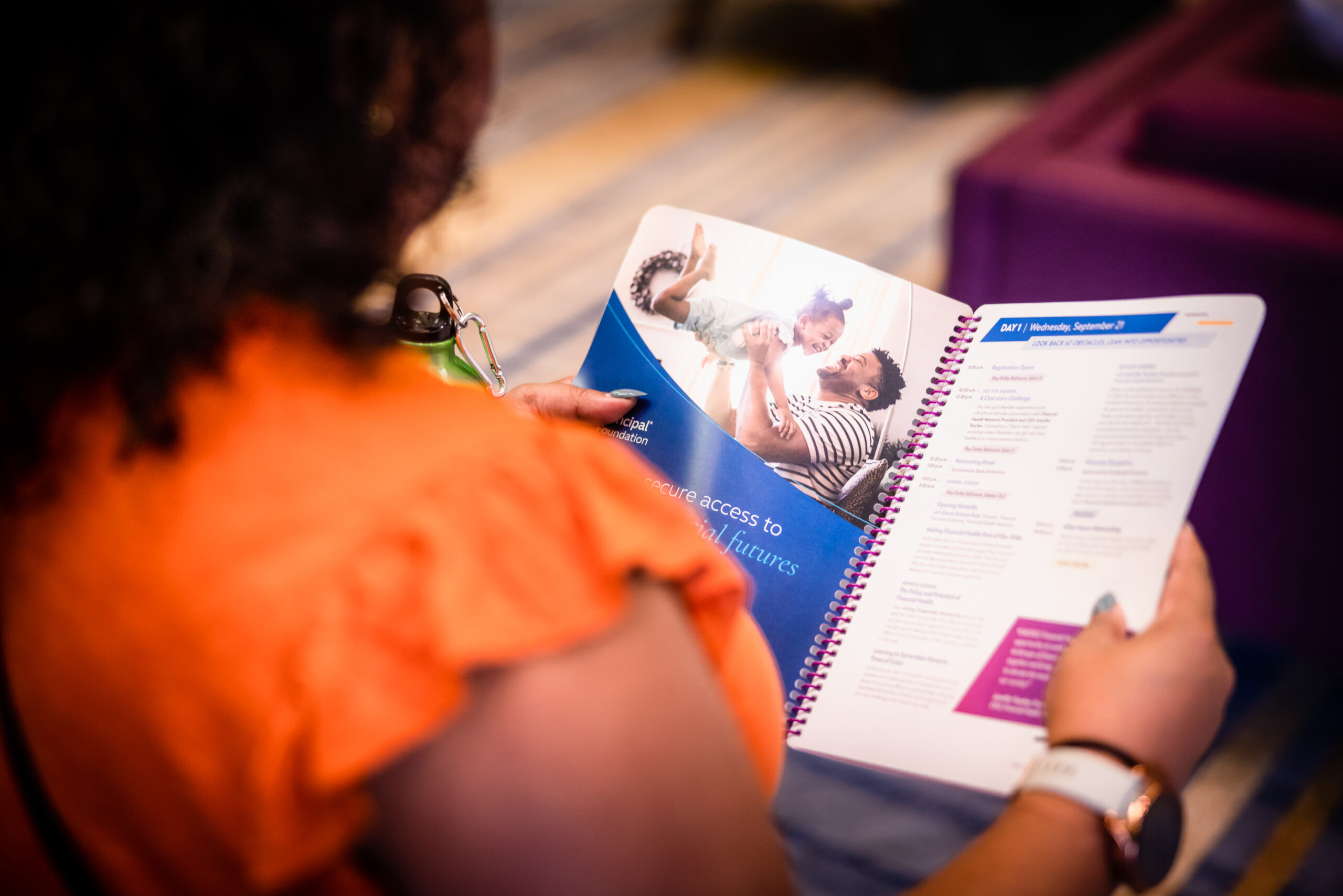 woman reads the EMERGE booklet