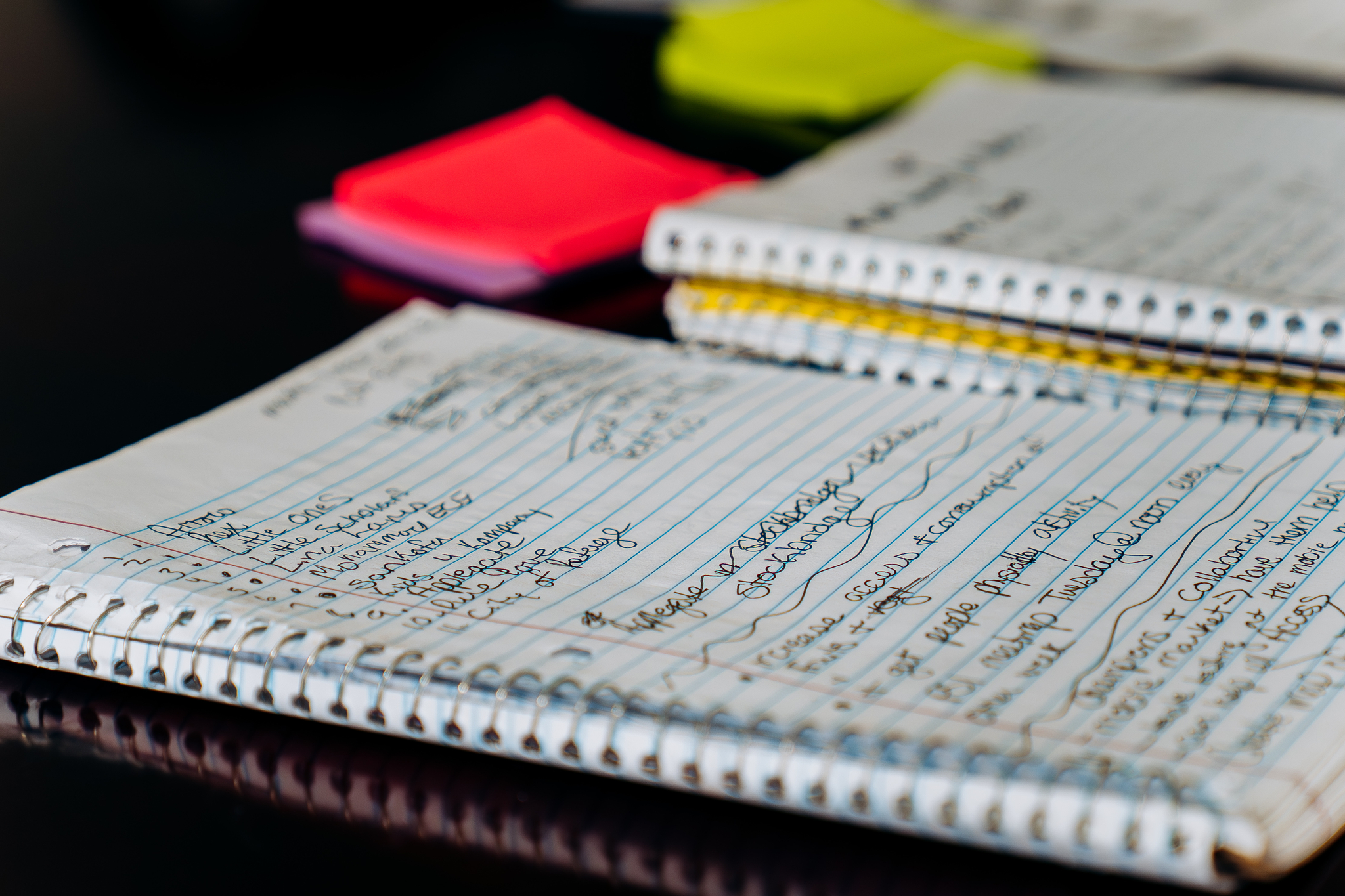 spiral notebooks filled with handwritten notes