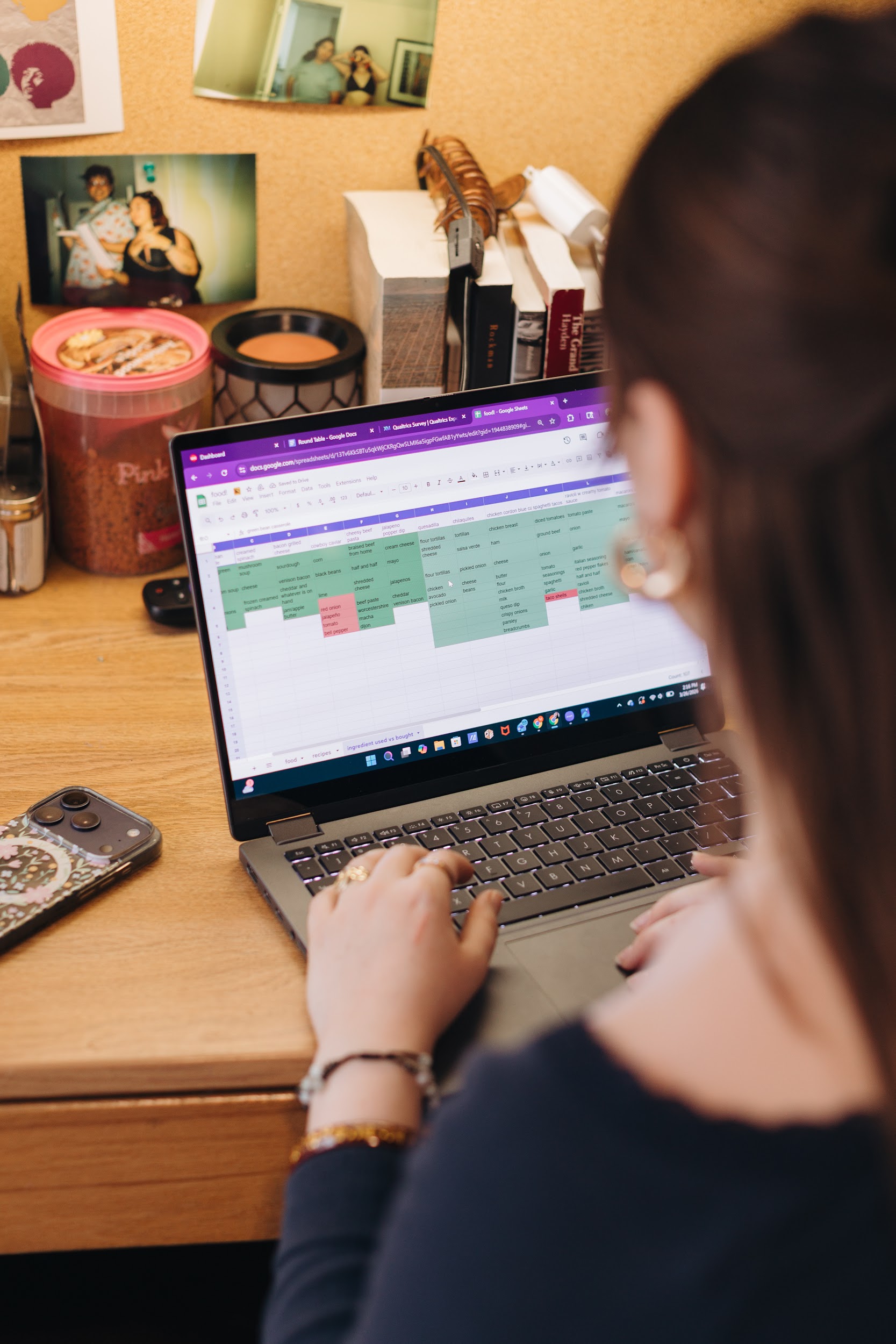 Margarita works on her budgeting spreadsheet on her laptop