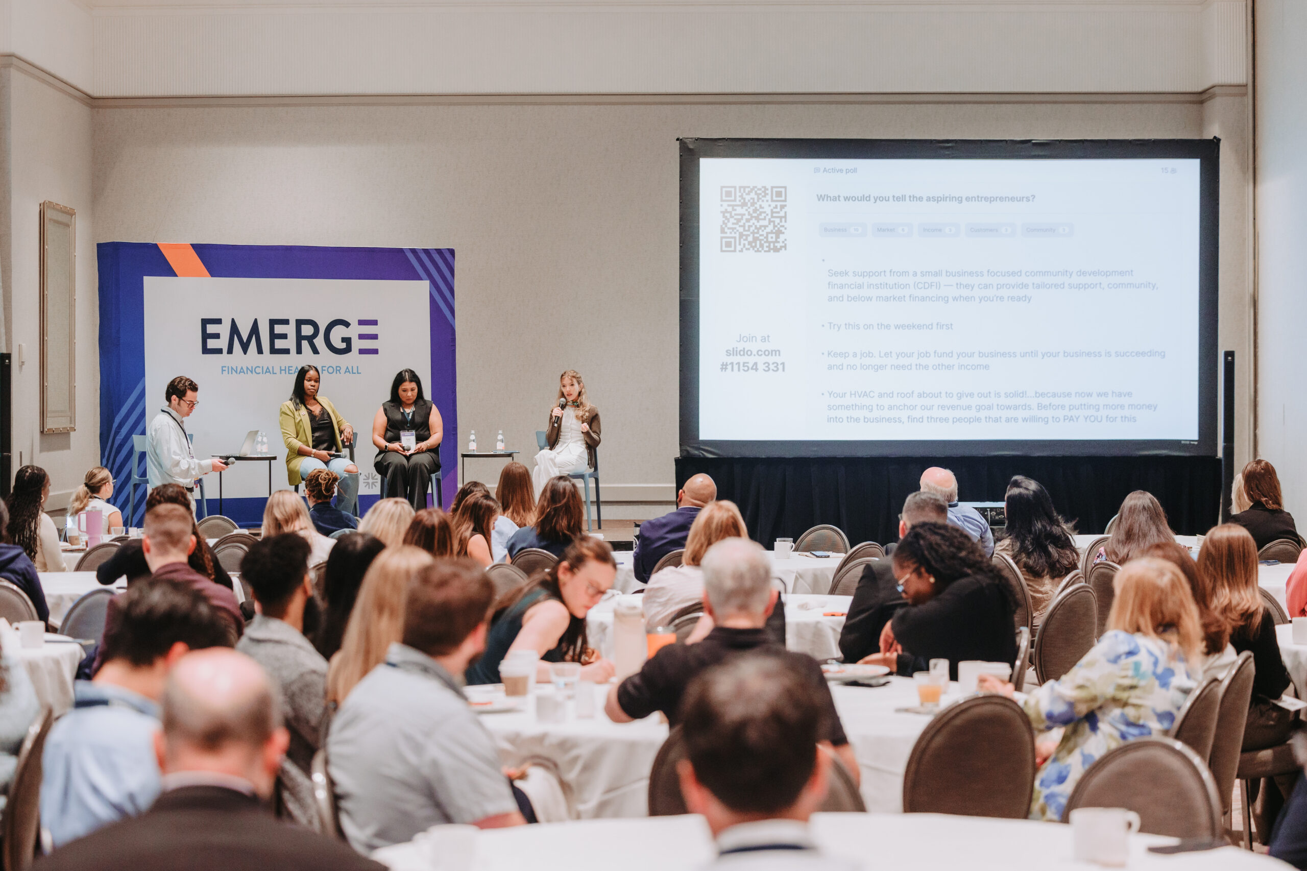 Attendees at EMERGE Financial Health 2026 listen in on a breakfast breakout session