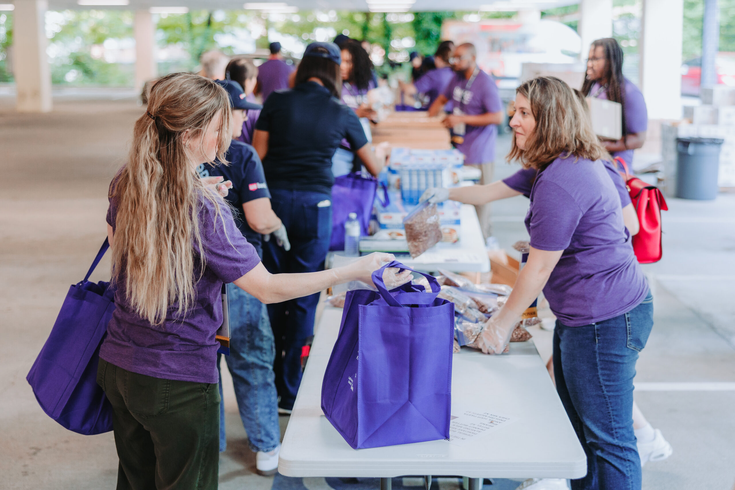 Attendees at EMERGE volunteer at a local food bank