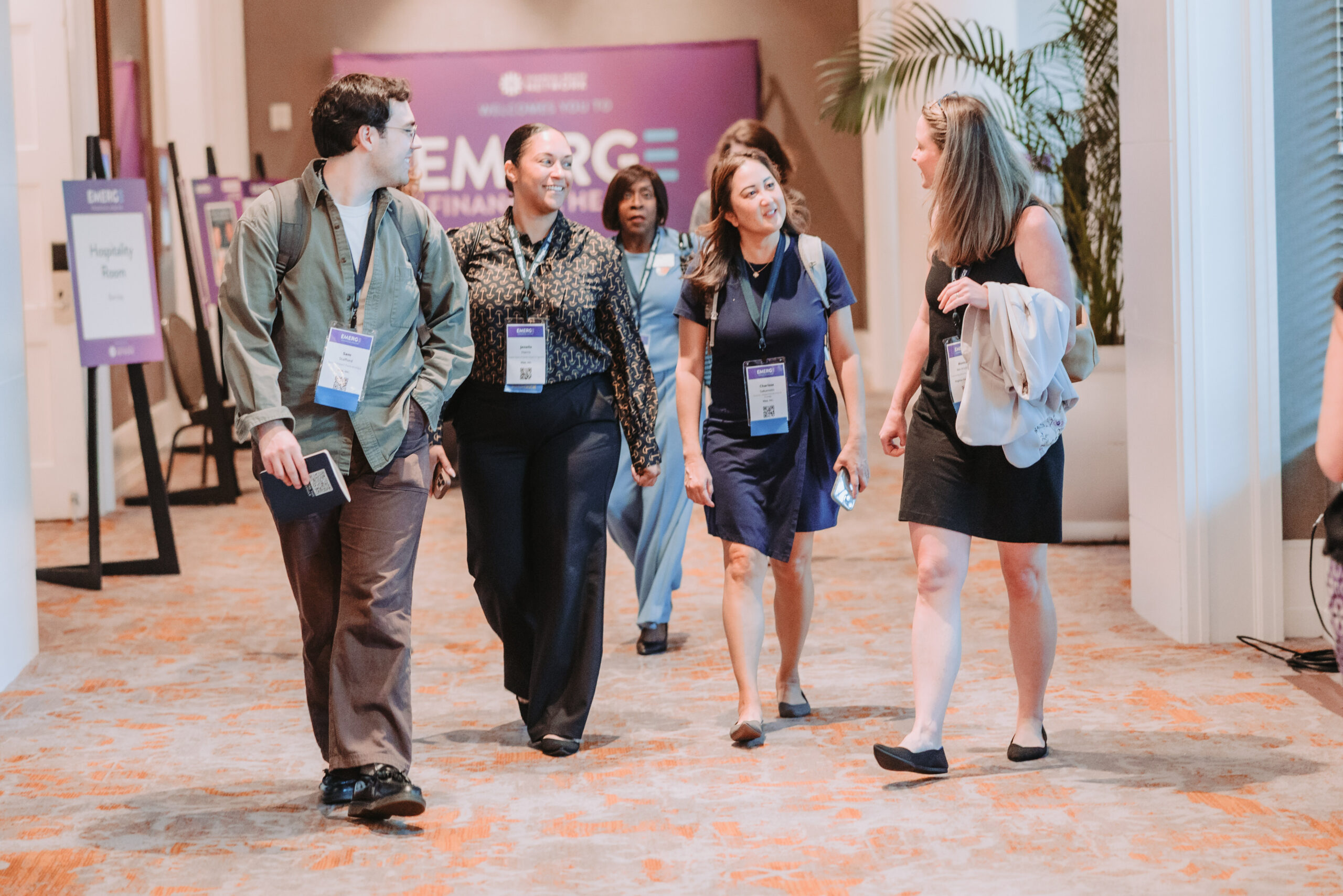 attendees walk and talk between sessions at EMERGE Financial Health 2026